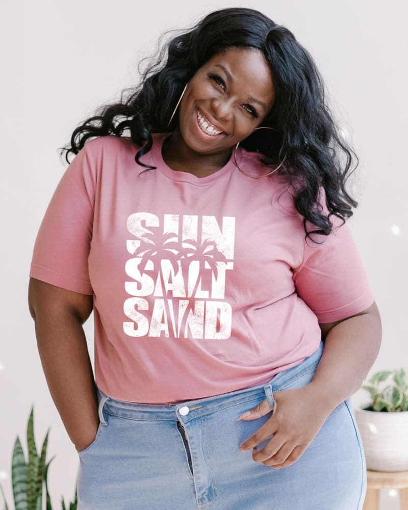 Front of a model wearing a size XL Sun Salt Sand Short Sleeve Graphic Tee in Mauve by Simply Sage Market. | dia_product_style_image_id:284254